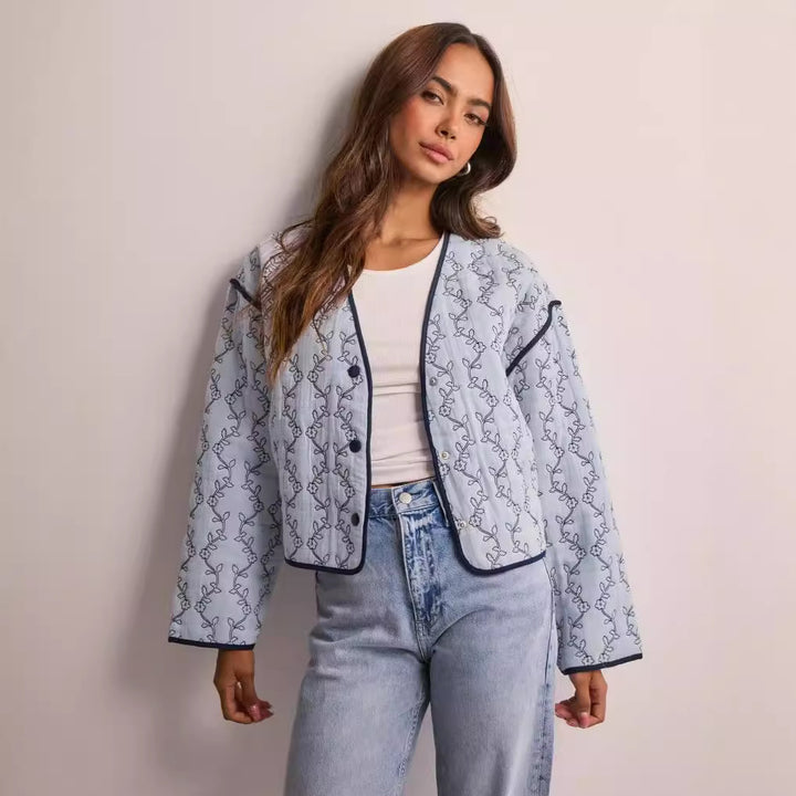 Women's lightweight quilted blouse jacket with V-neck, contrast piping and floral line print Amarae