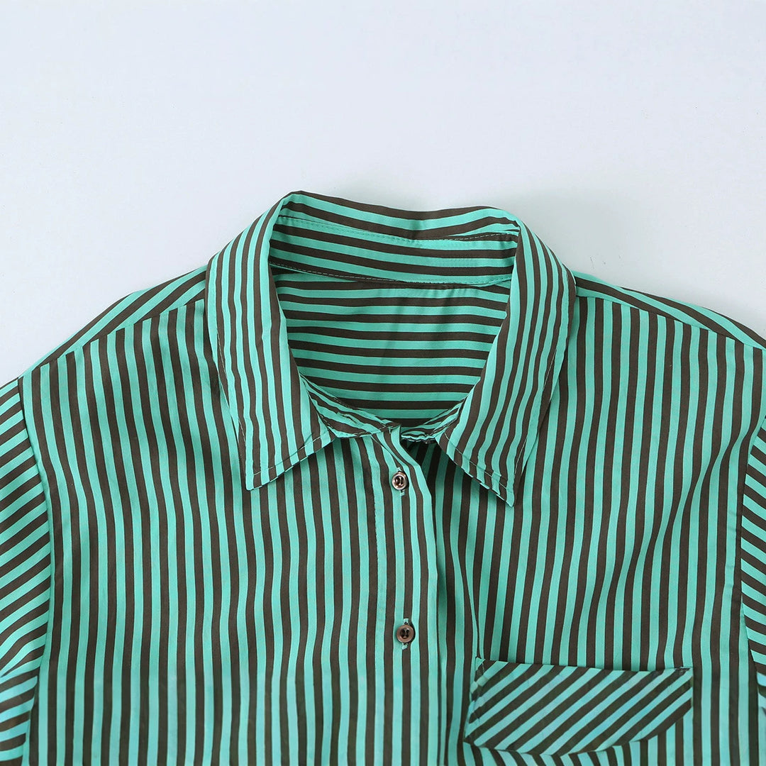 Women's oversized shirt blouse with diagonal stripe pattern, breast pocket, and asymmetrical hem.