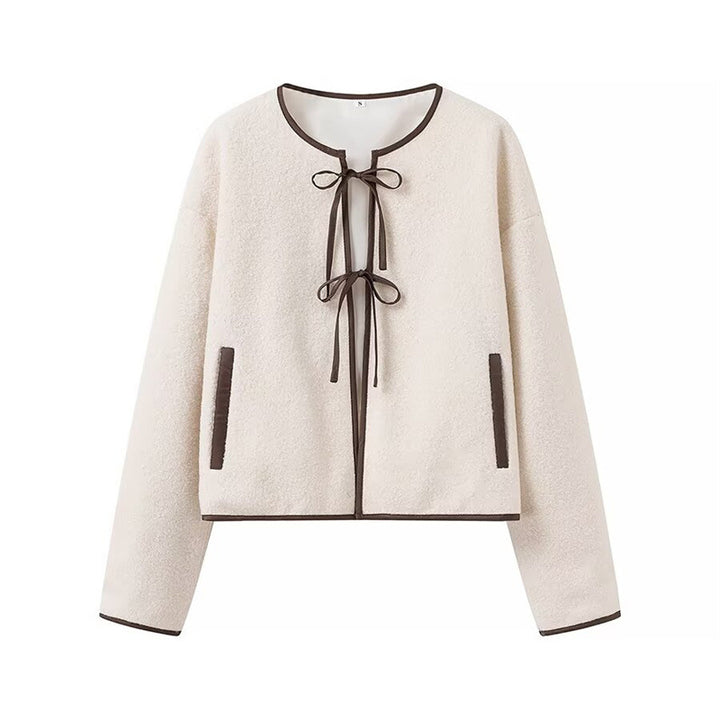 Fashion women's transitional jacket with decorative drawstring and side pockets.