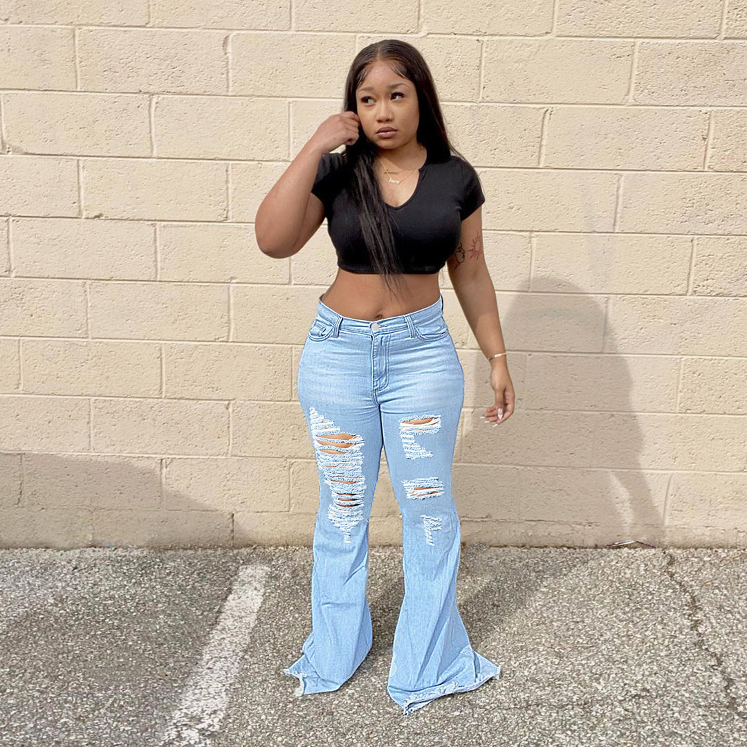 Women's high-waisted flared jeans with large rips and extra wide hem Amarae