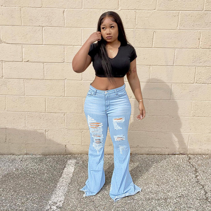 Women's high-waisted flared jeans with large rips and extra wide hem Amarae