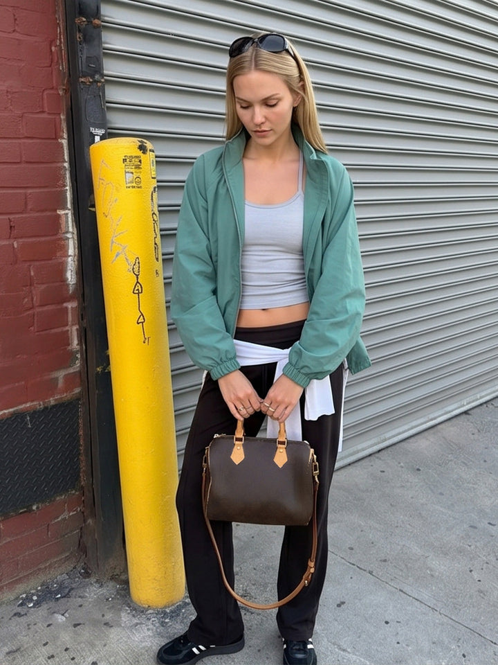 Ladies sporty-urban windbreaker with short cropped cut, high stand-up collar and elastic cuffs