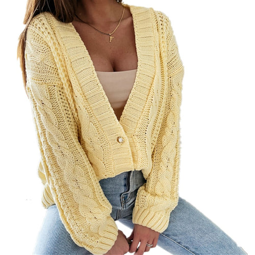 Women's knitted jacket with decorative cable design and unique button details Amarae