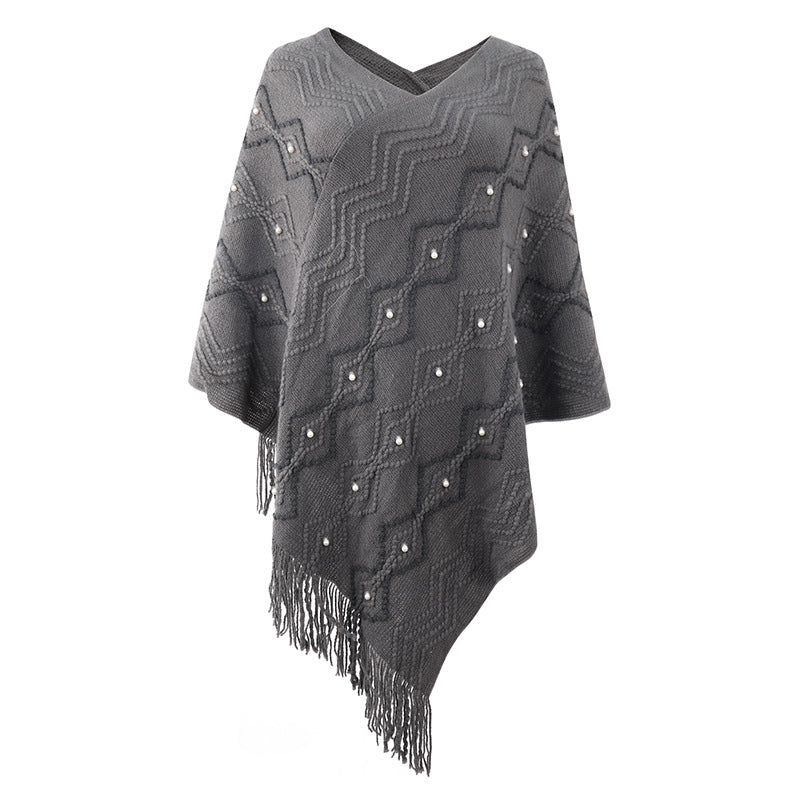 Lune London Elegant poncho for women with a striking textured pattern and decorative fringes