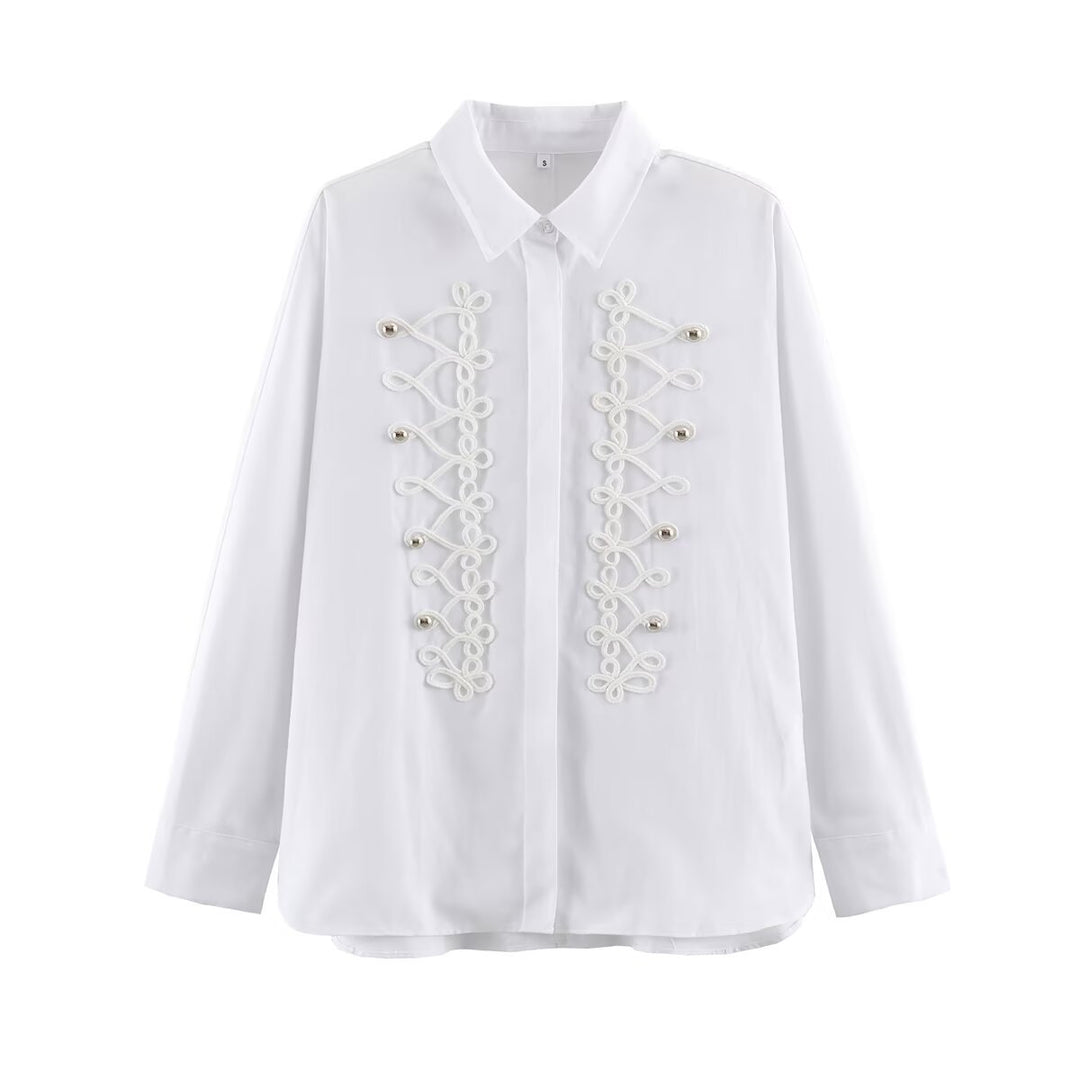 Women's blouse with long sleeves and decorative frog jewelry as well as concealed button placket