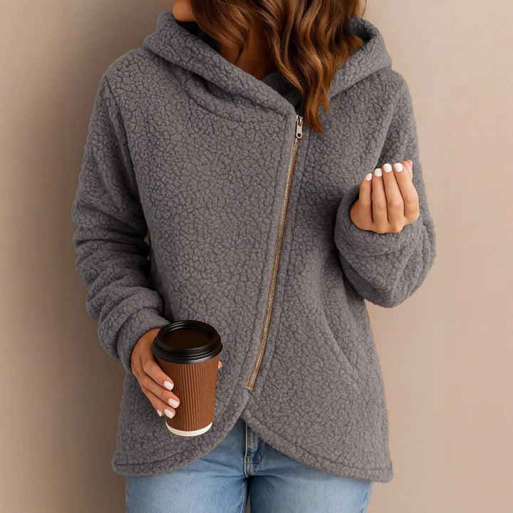 Women's teddy fleece jacket with asymmetrical zipper, hood and curved hem Amarae