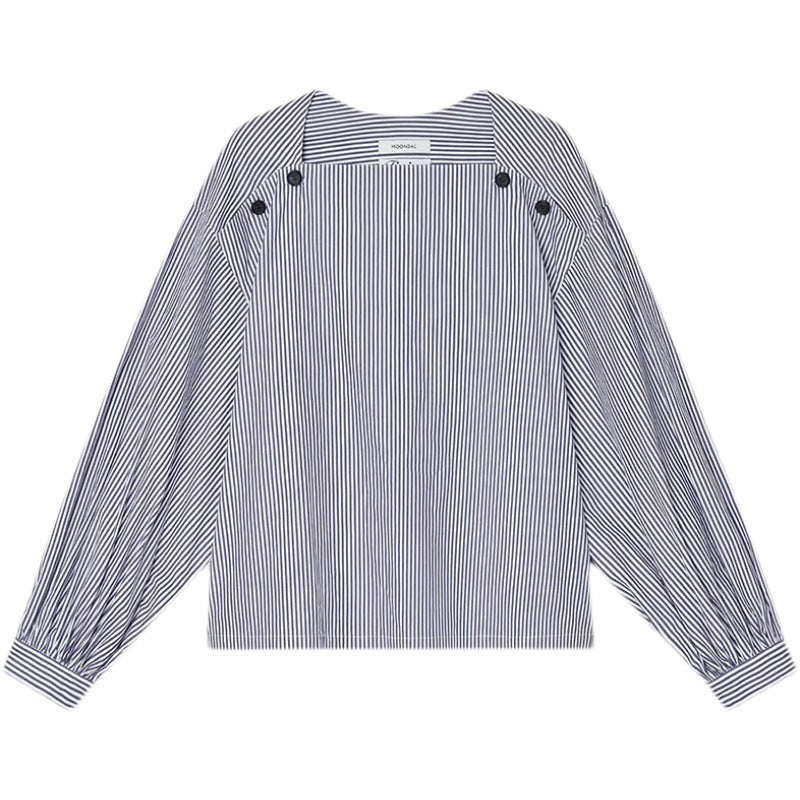 Blouse féminine à la mode avec des détails de bouton innovants Chic & Stil