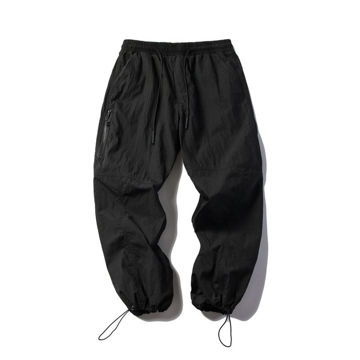 Unisex Technical Cargo Pants in Baggy Cut with Drawstring Waist and Adjustable Leg Closures Amarae