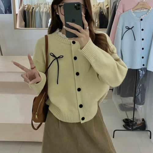 Knit cardigan for women with decorative buttons and a bow accent Amarae