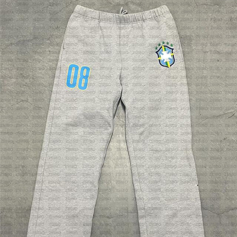 Women’s sporty jogging pants with practical side pockets and elastic waistband Chic & Stil