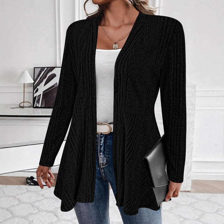 Women’s knitted jacket with a playful design and a chic side belt.