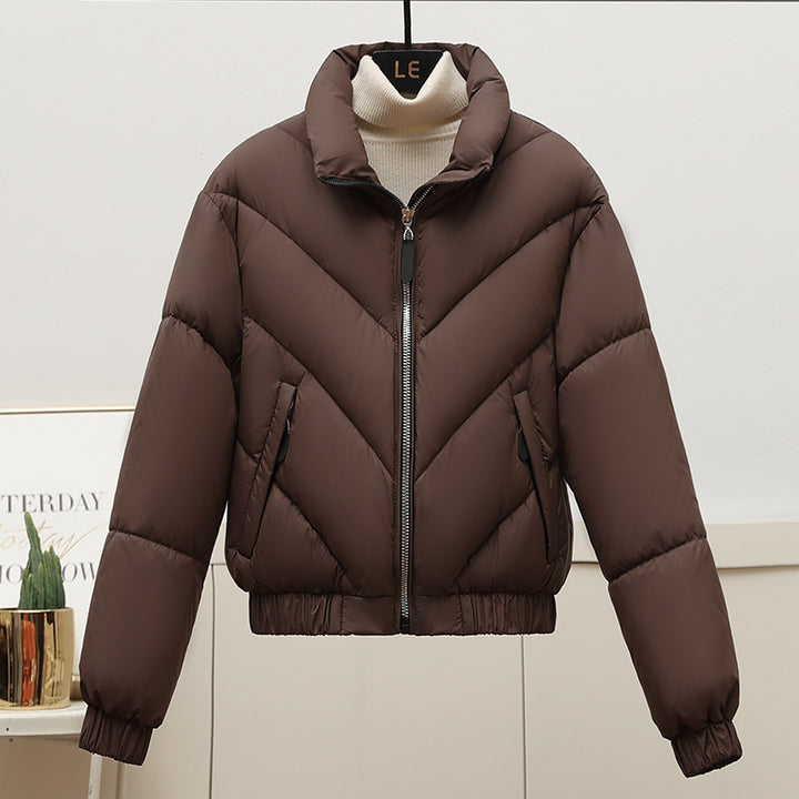 Trendy and comfortable women's puffer jacket with high collar and practical piped pockets Lune London