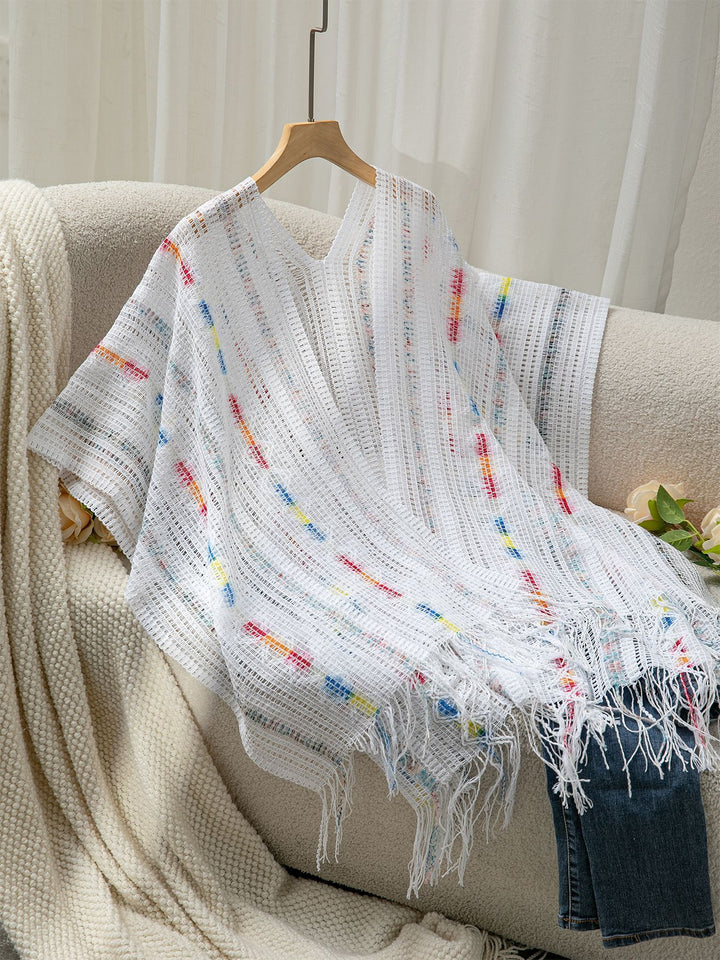 Ladies casual poncho with fringe details and a chic and stylish colorful pattern