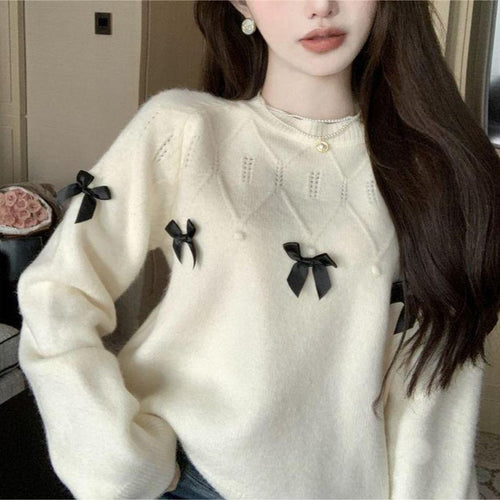 Pull confortable pour femmes avec des appliqués en nœud ludiques Chic & Stil