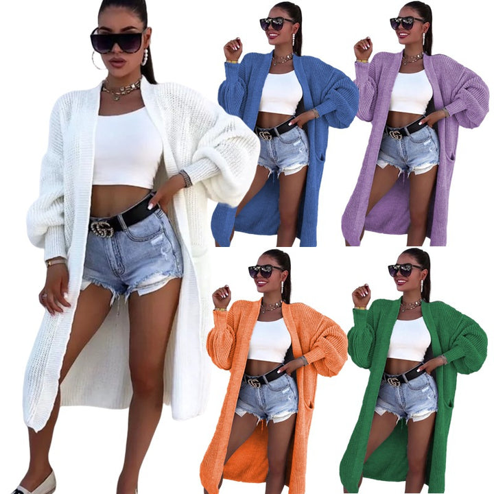 Long knitted coat for women with oversized sleeves and practical pockets Lune London
