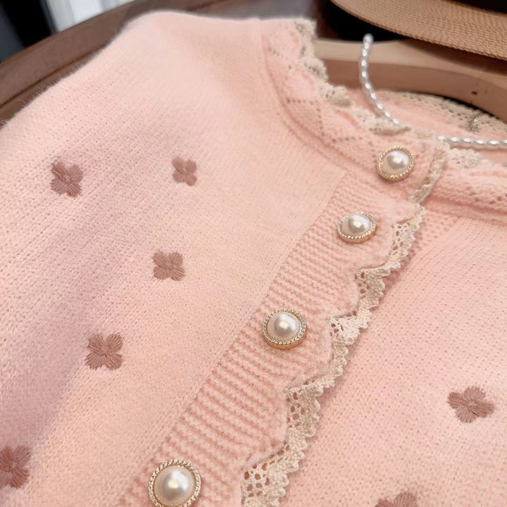 Knitted jacket for women with decorative pearl buttons and a delicate ribbed structure Lune London