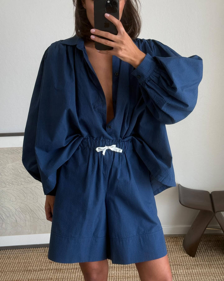 Woman casual outfit combined with loose blouse and shorts Lune London
