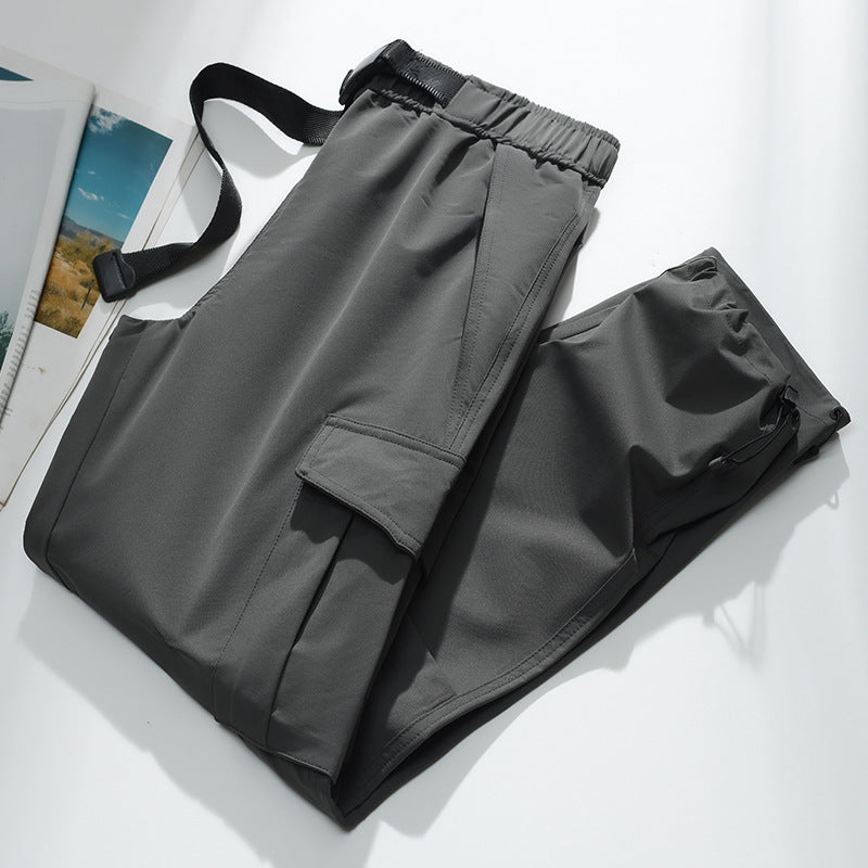 Men's cargo joggers with elastic waistband, drawstring, adjustable leg cuffs, and patch pockets.