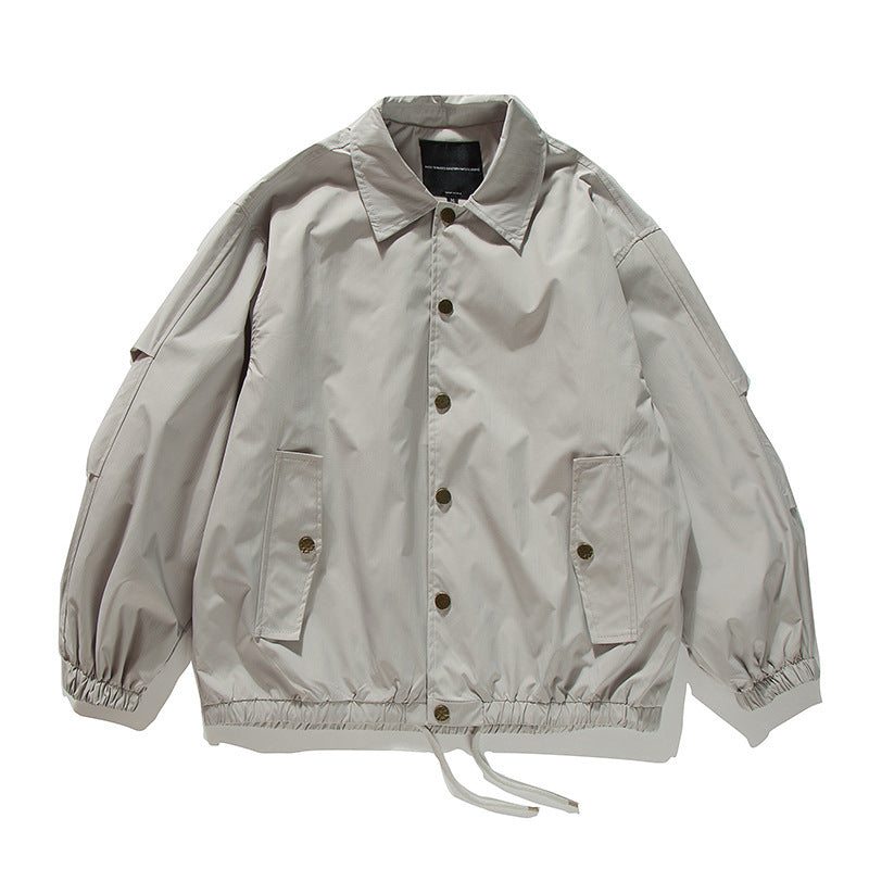 Unisex Boxy transitional bomber jacket with drawstring hem and snap button placket Amarae