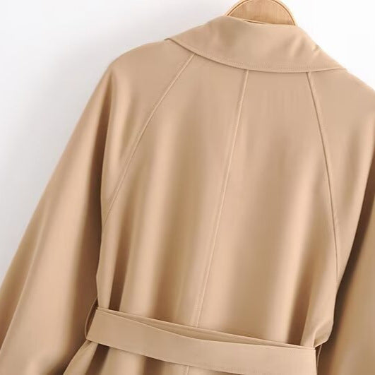 Women Short Tailored Trench Coat with Tied Belt, Asymmetrical Storm Flap and Cuff Strap Amarae