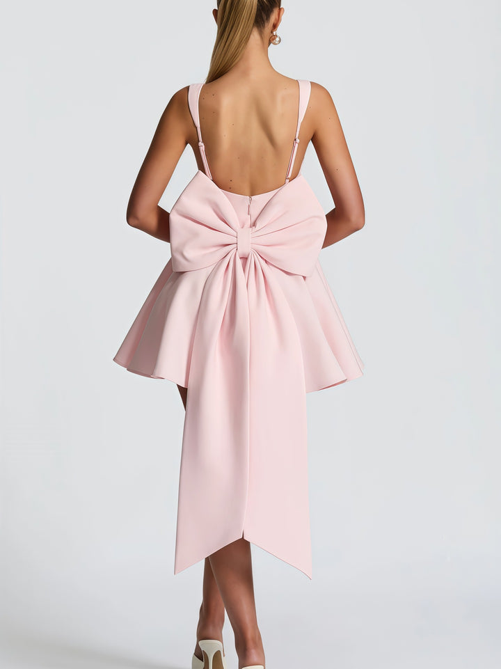 Women's cocktail dress with oversized bow design and flowing skirt Lune London