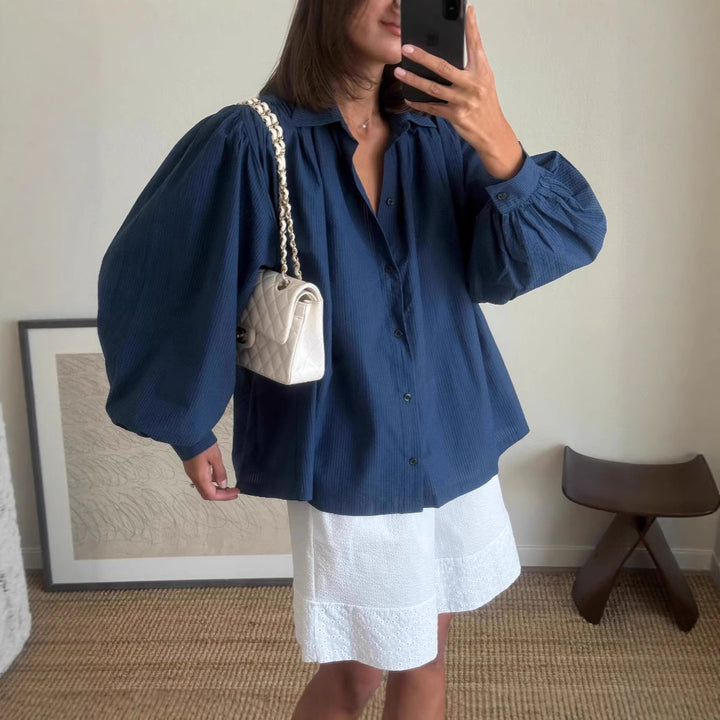 Woman casual outfit combined with loose blouse and shorts Lune London