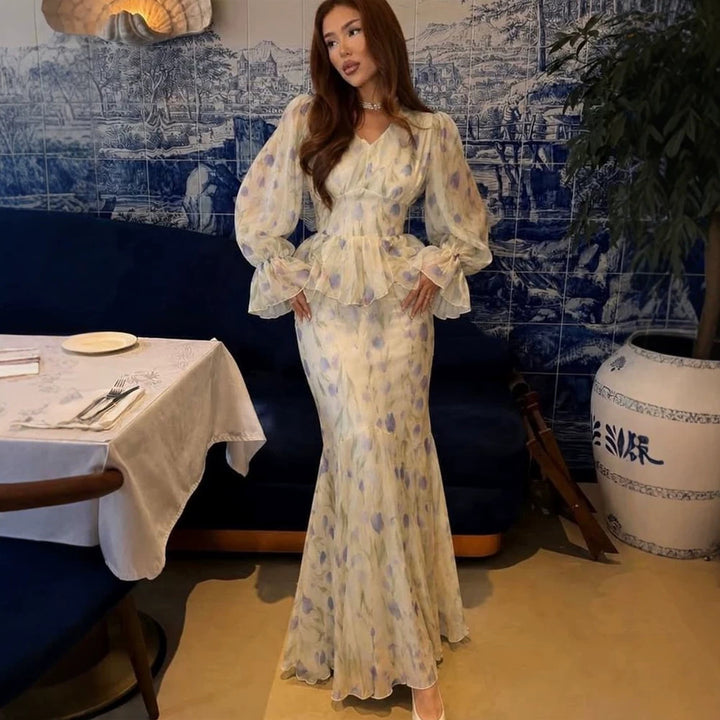 Women's dress made of transparent chiffon with fitted bodice, ruffled peplum and voluminous bell sleeves Amarae