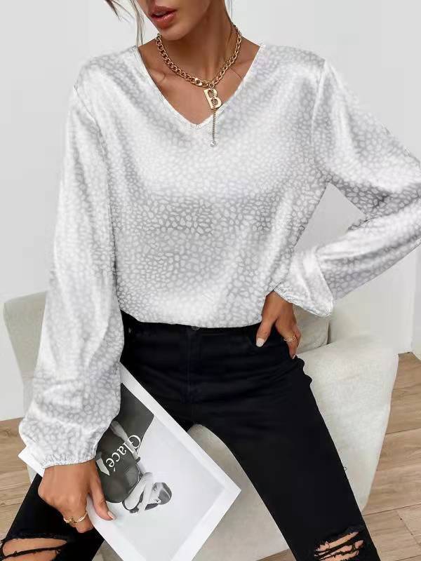 Blouse élégante pour femmes avec col en V et manches volumineuses Chic & Stil