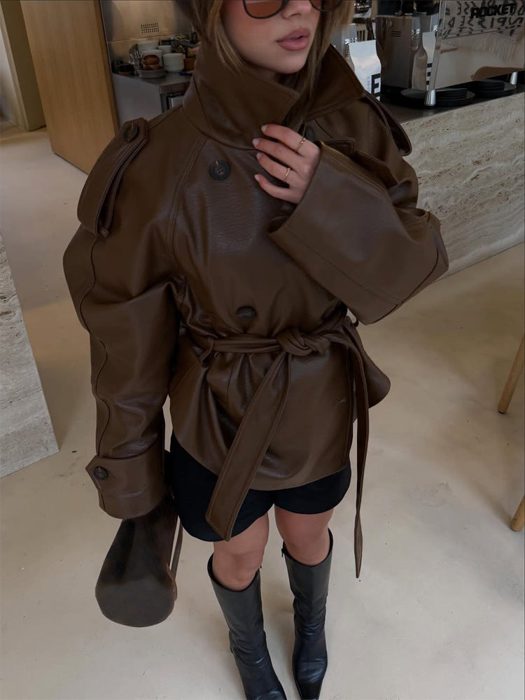 Women’s short cut oversized faux leather trench coat with waist belt and epaulettes Amarae