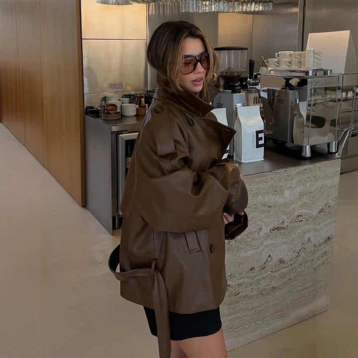 Women’s short cut oversized faux leather trench coat with waist belt and epaulettes Amarae