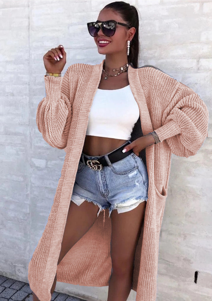 Long knitted coat for women with oversized sleeves and practical pockets Lune London