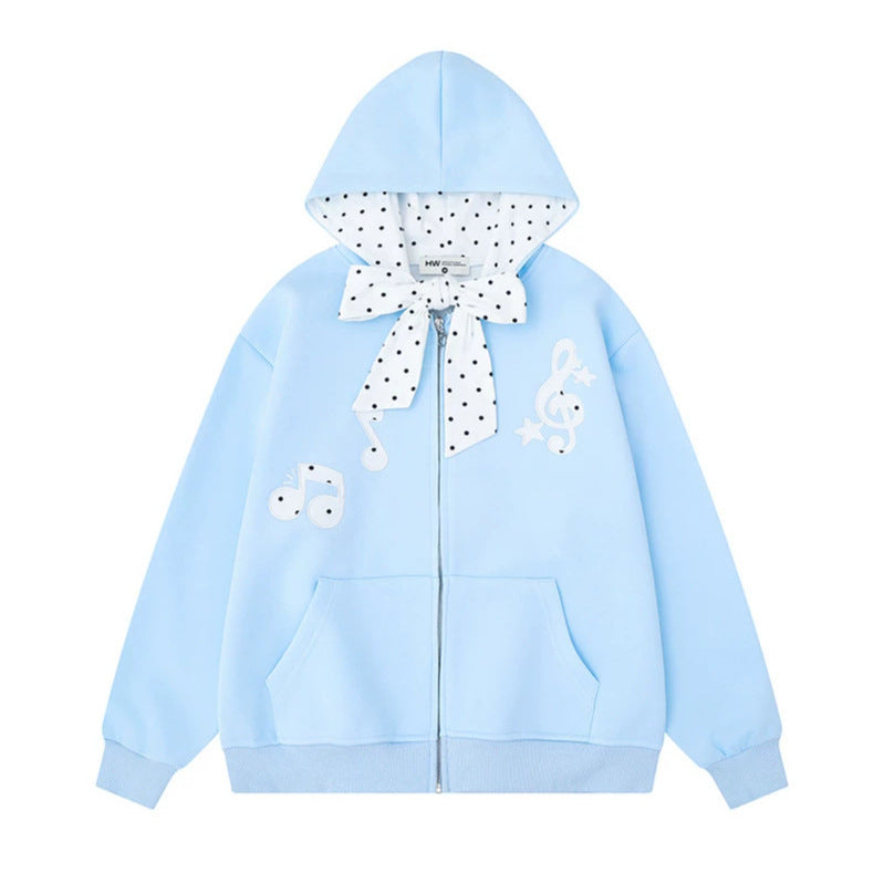 Women's hooded sweat jacket with polka dot hood lining, decorative bow, and music notes motif Amarae