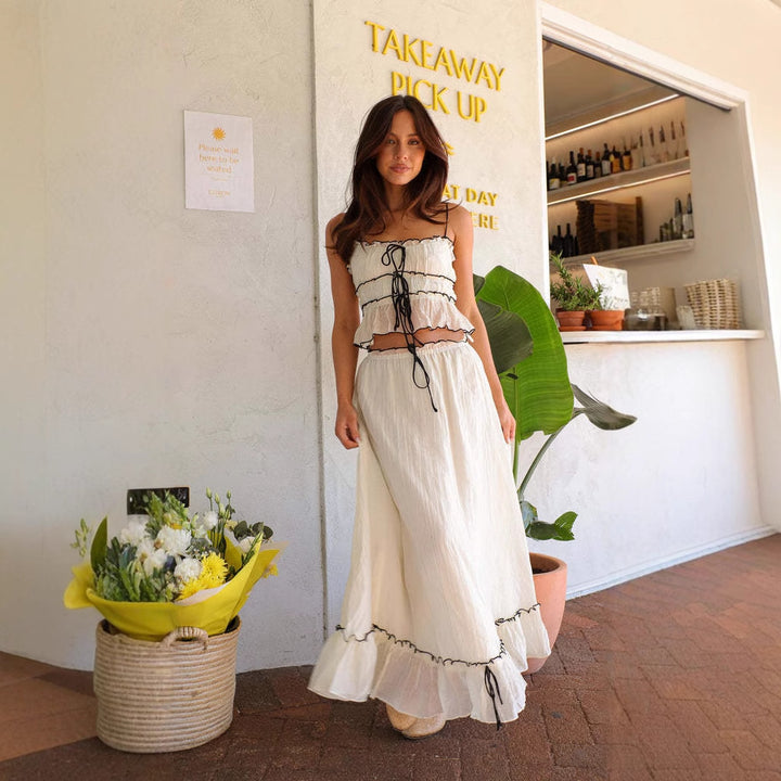 Ladies' maxi dress with playful ruffled hem and practical tie bands Lune London