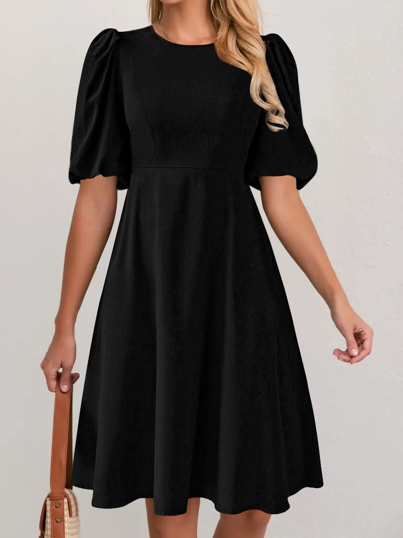 Puff sleeve dress for women with a flowing cut and waist accentuation Lune London