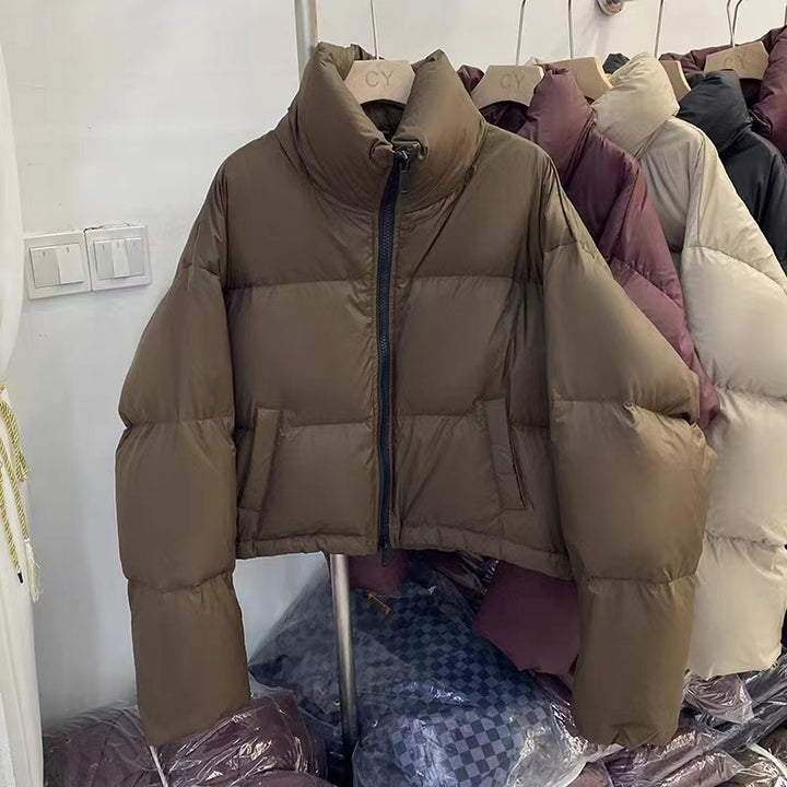 Ladies short functional quilted jacket with high collar and side pockets Amarae