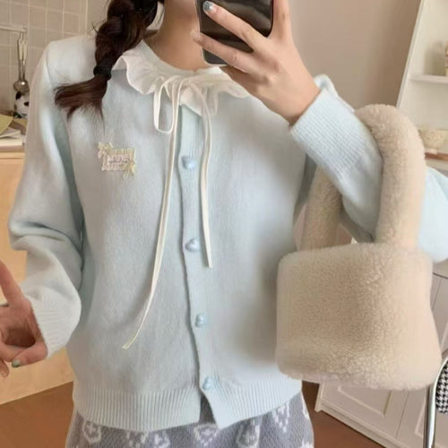 Ladies playful cardigan with ruffle detail and pearl-like buttons Amarae