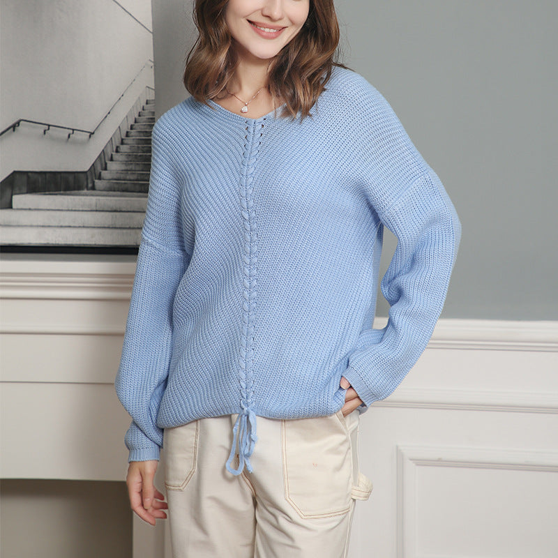 Women's thick knit sweater with an attractive V-neckline and practical drawstring details Lune London