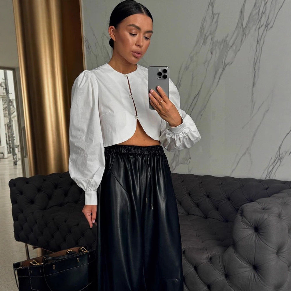 Women short-cut blouse with curved hem edge and voluminous puff sleeves Amarae