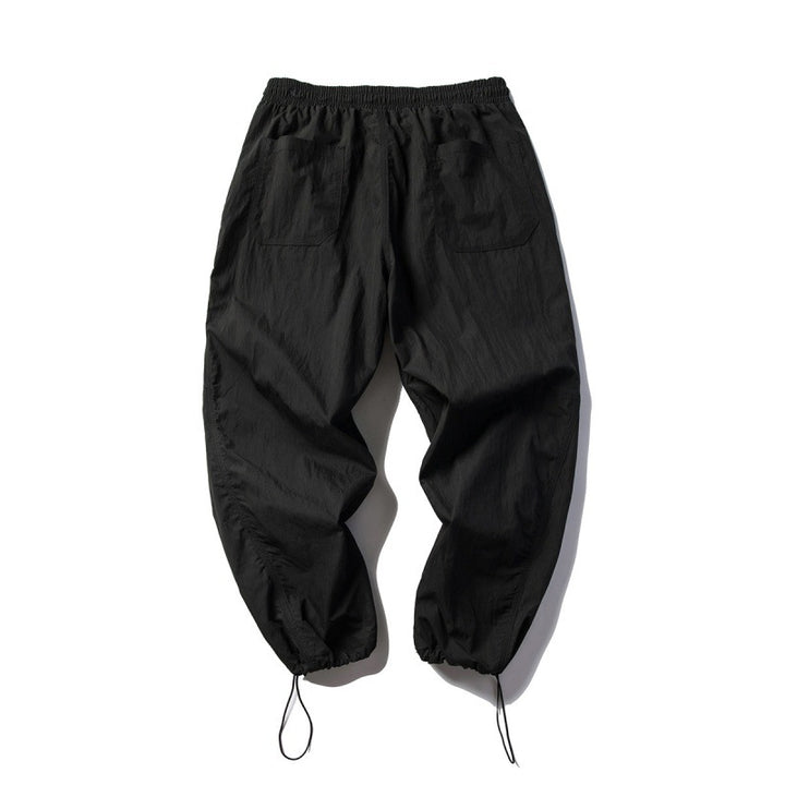 Unisex Technical Cargo Pants in Baggy Cut with Drawstring Waist and Adjustable Leg Closures Amarae