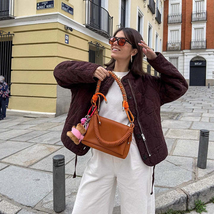 Women's shoulder bag made of synthetic leather with braided handle and spiral-shaped front grip Amarae
