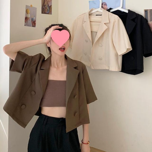 Women's short blazer with double button placket and fashionable cut