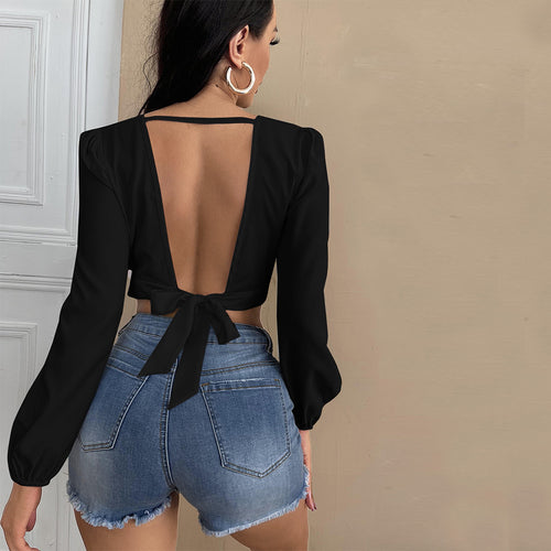 Top cropped féminin avec décolleté en V profond et manches bouffantes élégantes Chic & Stil