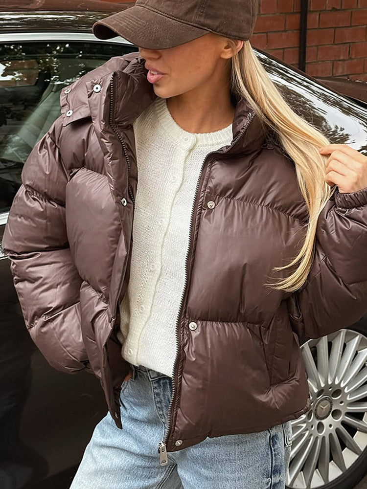 Women's short-cut shiny quilted jacket with high stand-up collar and snap-button placket Amarae