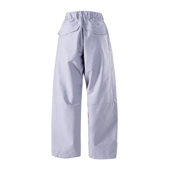 Women's wide technical trekking pants with reinforced knees, zippered pockets, and adjustable hem Amarae