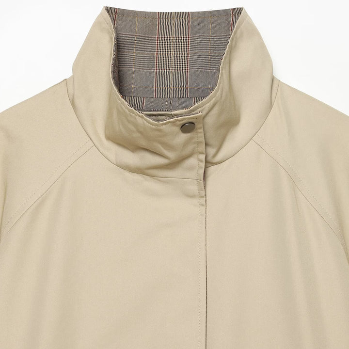 Women's reversible lightweight transitional jacket with stand-up collar, raglan sleeves, and drawstring hem Amarae