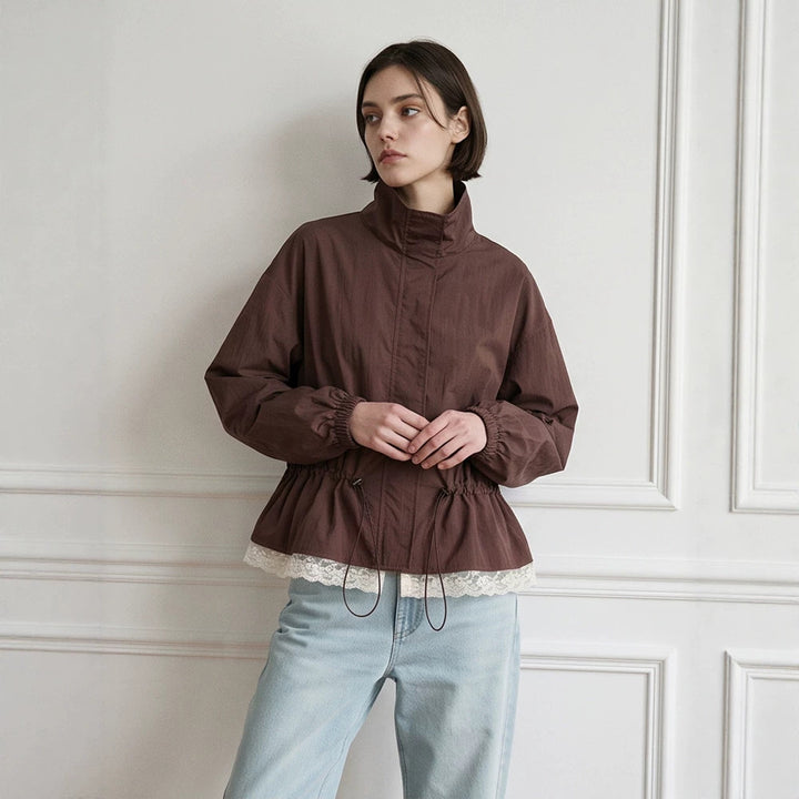 Women's oversized windbreaker with high stand-up collar, drawstring waist, and elastic cuffs