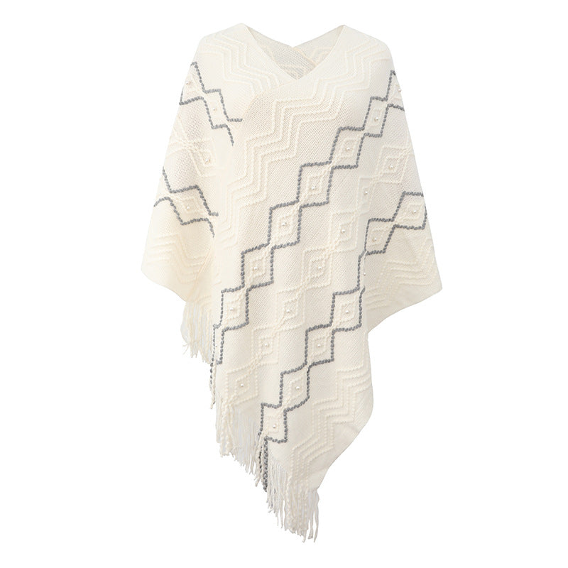 Lune London Elegant poncho for women with a striking textured pattern and decorative fringes