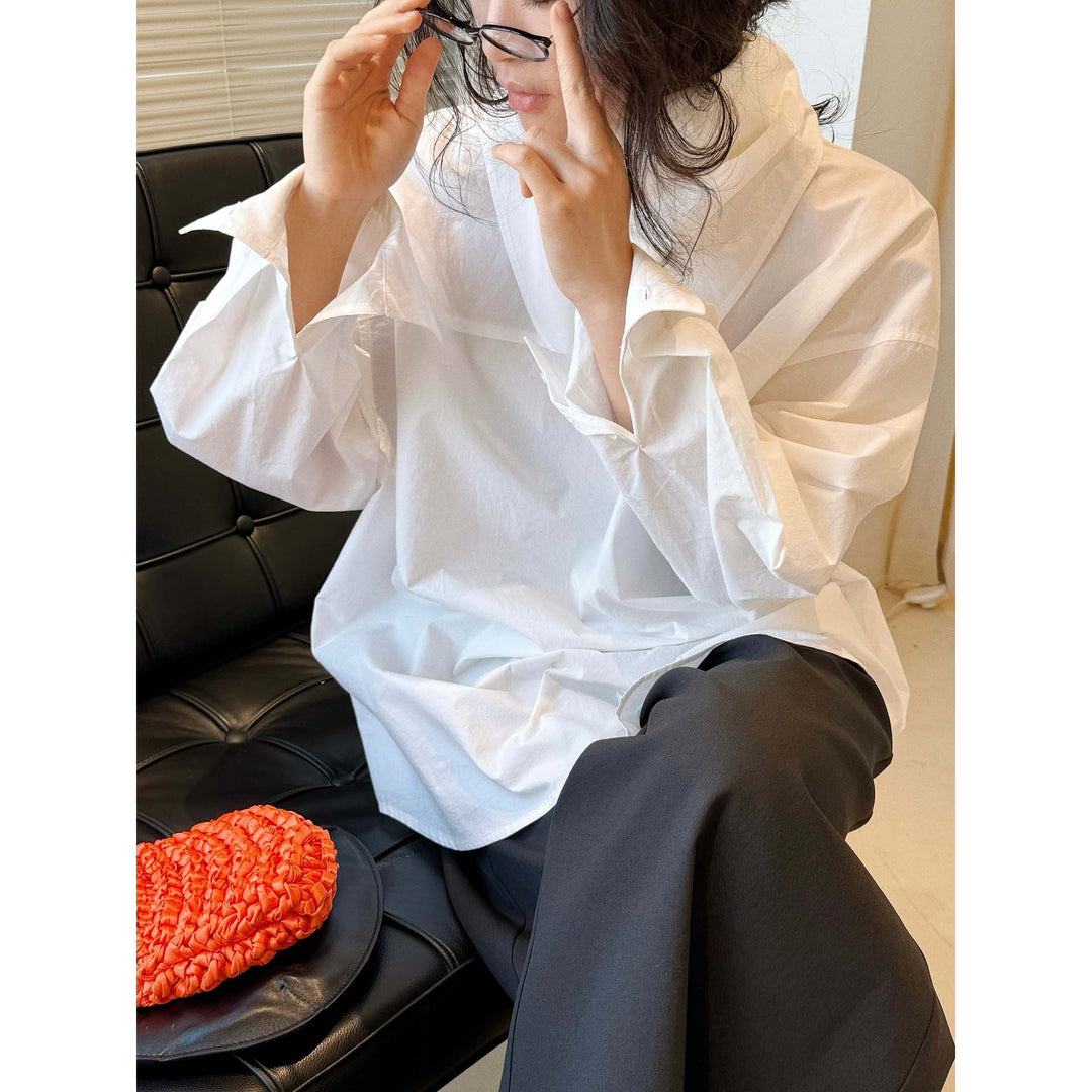 Women loosely cut cotton blouse with wrapped shawl collar and wide cuffs