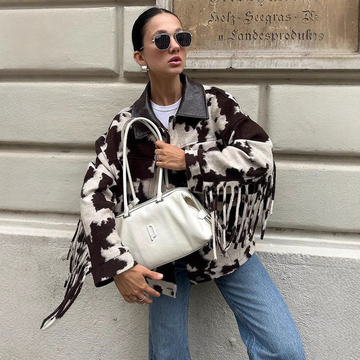 Ladies short jacket in cow print with fringes, faux fur look and leather collar Amarae