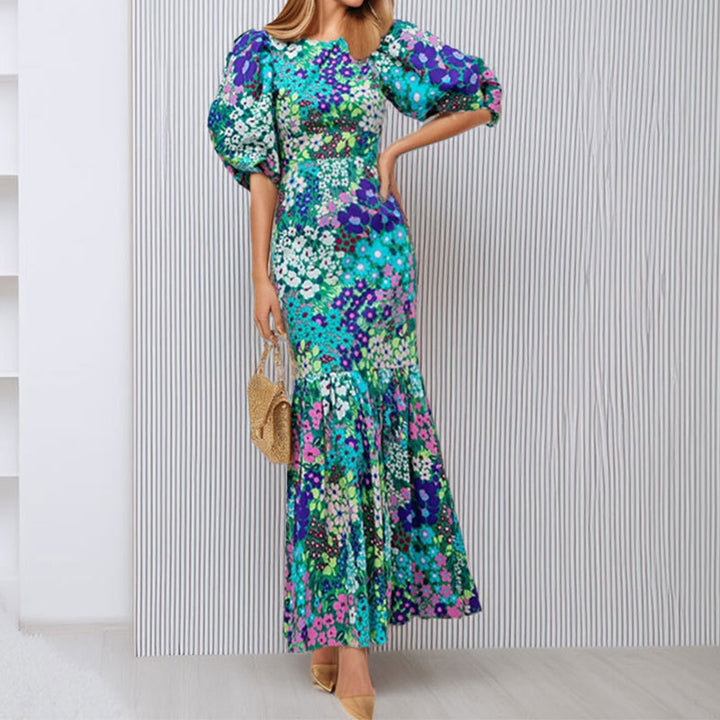Robe maxi pour femmes avec des manches bouffantes volumineuses et des motifs floraux Chic & Stil